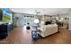 Bright living room featuring neutral walls, hardwood floors, and plenty of natural light at 30446 W Picadilly Rd, Buckeye, AZ 85396
