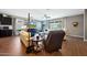 Bright living room with hardwood floors, comfortable seating, and a ceiling fan at 30446 W Picadilly Rd, Buckeye, AZ 85396