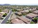 Aerial view showcasing a house with a well-maintained landscape, a pool, and its placement in a residential community at 3578 E Walnut Rd, Gilbert, AZ 85298