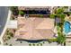 Aerial view of the roof and backyard featuring a seating area, a patio, and beautiful landscaping at 3578 E Walnut Rd, Gilbert, AZ 85298