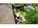 Backyard featuring a built-in grill, patio seating, artificial turf, and mature landscaping, perfect for outdoor entertaining at 3578 E Walnut Rd, Gilbert, AZ 85298