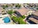 This home has an outdoor kitchen, a pool with a basketball hoop, and flowering landscaping that provides an entertaining space at 3578 E Walnut Rd, Gilbert, AZ 85298