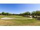 Well-manicured green space with mature trees and walking path for residents to enjoy at 3578 E Walnut Rd, Gilbert, AZ 85298