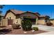 Single-Gathering home displaying desert landscaping, attached two-car garage, and tiled roof at 3578 E Walnut Rd, Gilbert, AZ 85298