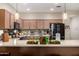 Kitchen with light countertops, stainless steel appliances, mosaic tile backsplash, and pendant lighting at 3578 E Walnut Rd, Gilbert, AZ 85298