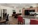 Open-concept living area with kitchen island and sleek black appliances at 3578 E Walnut Rd, Gilbert, AZ 85298