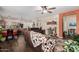 Open-concept living room with hardwood floors, kitchen view, and natural light at 3578 E Walnut Rd, Gilbert, AZ 85298