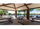 Scenic covered picnic area overlooking a tranquil lake, perfect for outdoor gatherings at 3578 E Walnut Rd, Gilbert, AZ 85298