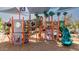 Community playground offering a diverse range of play equipment under a shade canopy at 3578 E Walnut Rd, Gilbert, AZ 85298