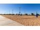 Well-maintained sand volleyball courts under a clear blue sky, ideal for recreational activities at 3578 E Walnut Rd, Gilbert, AZ 85298