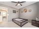 This bedroom features neutral grey walls, a ceiling fan, carpeted floors, and a bed at 38659 N Alamo Ct, San Tan Valley, AZ 85140