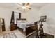 Bedroom featuring hardwood floors, a ceiling fan, a bed and an exercise bike at 38659 N Alamo Ct, San Tan Valley, AZ 85140