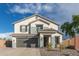 Charming two-story home with a well-manicured front yard, neutral tones, and a two car garage at 38659 N Alamo Ct, San Tan Valley, AZ 85140