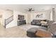 Bright living room with a comfortable sectional sofa, modern decor, and stylish wood-look flooring at 38659 N Alamo Ct, San Tan Valley, AZ 85140