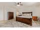 Bright main bedroom featuring a king size bed, hardwood floors, and neutral decor at 38659 N Alamo Ct, San Tan Valley, AZ 85140