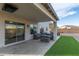 Covered patio with comfortable outdoor seating, offering a relaxing space for entertainment and leisure at 38659 N Alamo Ct, San Tan Valley, AZ 85140