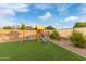 Outdoor playground provides endless fun, set on artificial turf with a backdrop of well-maintained landscaping at 38659 N Alamo Ct, San Tan Valley, AZ 85140