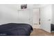 Bright bedroom features a comfortable bed and closet perfect for any resident seeking comfort and convenience at 39959 W Williams Way, Maricopa, AZ 85138