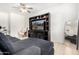 Cozy living area with entertainment center, television, and comfortable sofa seating at 39959 W Williams Way, Maricopa, AZ 85138
