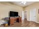 Bedroom featuring wood floors and a desk with storage at 4055 N Recker Rd # 62, Mesa, AZ 85215