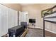 This bedroom features a set of bunkbeds, a TV, and access to an adjacent room at 4055 N Recker Rd # 62, Mesa, AZ 85215