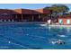 This beautiful community pool features lounge chairs, tables, and a shaded pavilion at 4055 N Recker Rd # 62, Mesa, AZ 85215