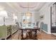 Elegant dining room featuring a large table with seating for eight and stylish light fixture at 4055 N Recker Rd # 62, Mesa, AZ 85215