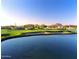 Scenic golf course view with a water feature and desert mountain backdrop, perfect for golfers at 4055 N Recker Rd # 62, Mesa, AZ 85215