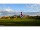 Scenic golf course with lush greens and views of the desert landscape, close to residential homes at 4055 N Recker Rd # 62, Mesa, AZ 85215