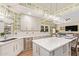 Bright kitchen featuring an island with quartz countertops and modern stainless steel appliances at 4055 N Recker Rd # 62, Mesa, AZ 85215