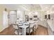 Bright kitchen featuring white cabinets, quartz countertops, stainless steel appliances, and a large island at 4055 N Recker Rd # 62, Mesa, AZ 85215