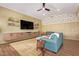 Relaxing living room with hardwood floors, TV, stylish decor, and a comfortable seating arrangement at 4055 N Recker Rd # 62, Mesa, AZ 85215