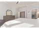 Spacious main bedroom with hardwood floors, a dresser, and an en-suite bathroom with modern finishes at 4055 N Recker Rd # 62, Mesa, AZ 85215
