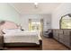 Inviting bedroom showcasing a comfortable bed, natural lighting, and well-coordinated decor for a relaxing retreat at 4055 N Recker Rd # 62, Mesa, AZ 85215