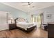 Serene bedroom featuring neutral tones, a comfortable king-size bed, and a ceiling fan for added comfort at 4055 N Recker Rd # 62, Mesa, AZ 85215