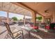 This patio is covered and features ample seating and an outdoor grill at 4055 N Recker Rd # 62, Mesa, AZ 85215