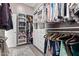 Organized walk-in closet with shelving, drawers, and hanging storage at 4055 N Recker Rd # 62, Mesa, AZ 85215