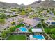 An aerial view of a luxury home with swimming pool, basketball court, outdoor space, and desert landscaping at 4417 W El Cortez Trl, Phoenix, AZ 85083