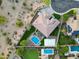 Beautiful backyard with a pool, sport court, patio, landscaping and verdant green grass at 4417 W El Cortez Trl, Phoenix, AZ 85083
