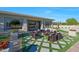 Backyard patio with outdoor furniture, pavers, and artificial grass at 4417 W El Cortez Trl, Phoenix, AZ 85083