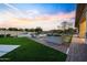Backyard with manicured landscaping, artificial turf, and inviting pool area at 4417 W El Cortez Trl, Phoenix, AZ 85083