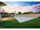 Outdoor basketball court with artificial grass and nice backyard in a well-kept neighborhood at 4417 W El Cortez Trl, Phoenix, AZ 85083