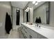 This bathroom features dual sinks, lots of counter space, and luxury fixtures at 4417 W El Cortez Trl, Phoenix, AZ 85083