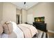 This bedroom features wood floors, a ceiling fan, and a large TV on the dresser at 4417 W El Cortez Trl, Phoenix, AZ 85083