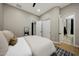 This bedroom features wood floors, neutral paint, and access to a private ensuite bathroom at 4417 W El Cortez Trl, Phoenix, AZ 85083