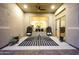 Covered patio with wicker chairs, tile flooring, and hanging lights at 4417 W El Cortez Trl, Phoenix, AZ 85083
