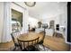 Spacious dining area showcasing open layout, modern lighting, and seamless flow to kitchen and living spaces at 4417 W El Cortez Trl, Phoenix, AZ 85083