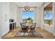 Bright dining area with ample natural light, modern light fixture, and convenient access to the kitchen at 4417 W El Cortez Trl, Phoenix, AZ 85083