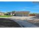 Stylish home with a spacious three-car garage, well-maintained lawn, and a circular driveway at 4417 W El Cortez Trl, Phoenix, AZ 85083