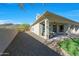 Home exterior with a gravel side yard, covered patio, and backyard at 4417 W El Cortez Trl, Phoenix, AZ 85083